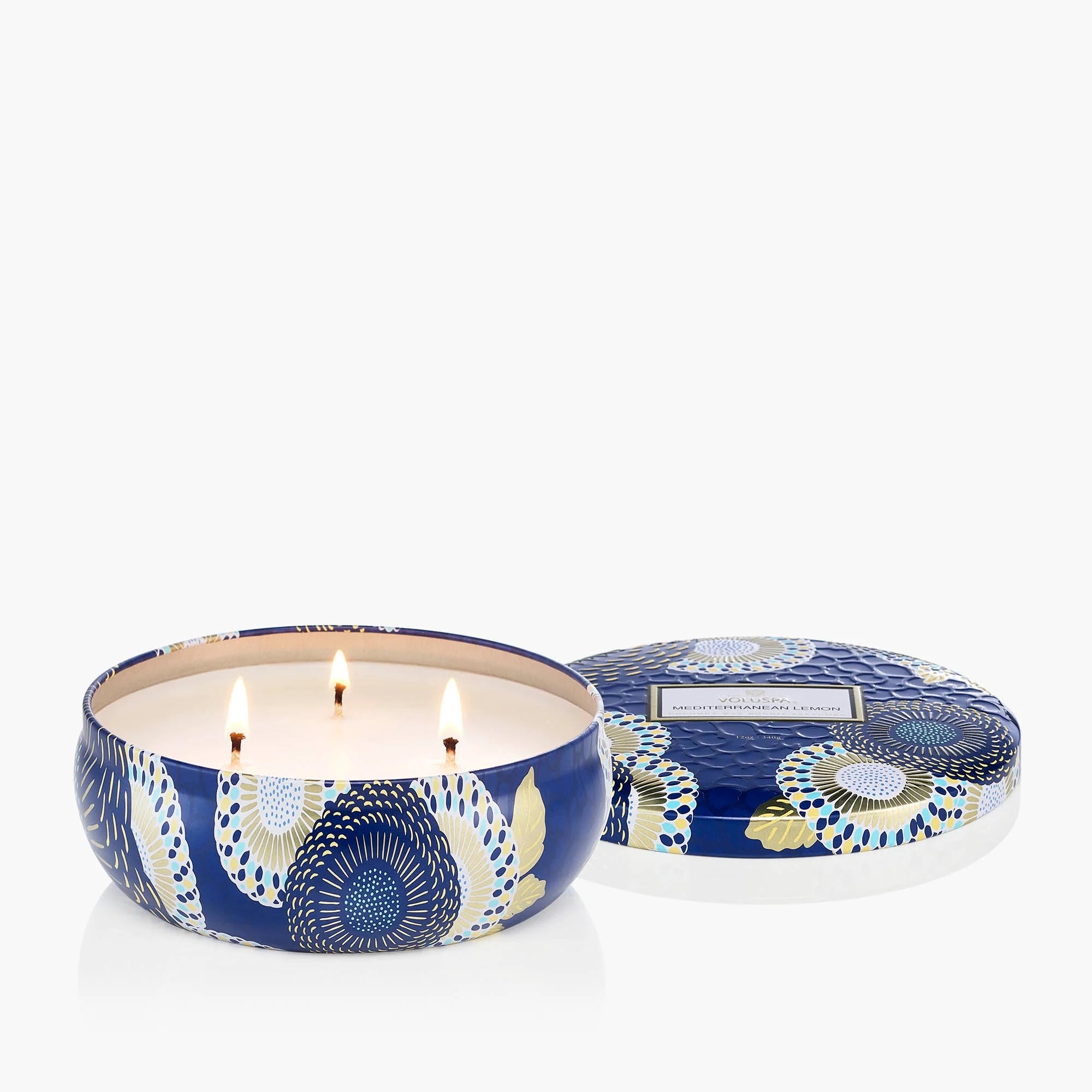 close up photo of three-wick Voluspa candle