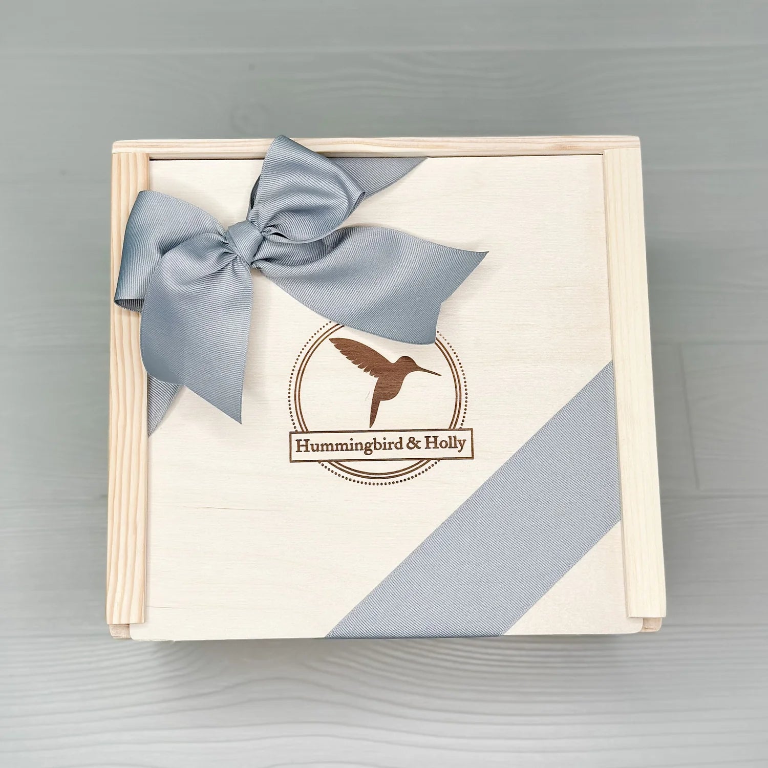 close up of the large wooden slide lid box included in our mom and baby gift box
