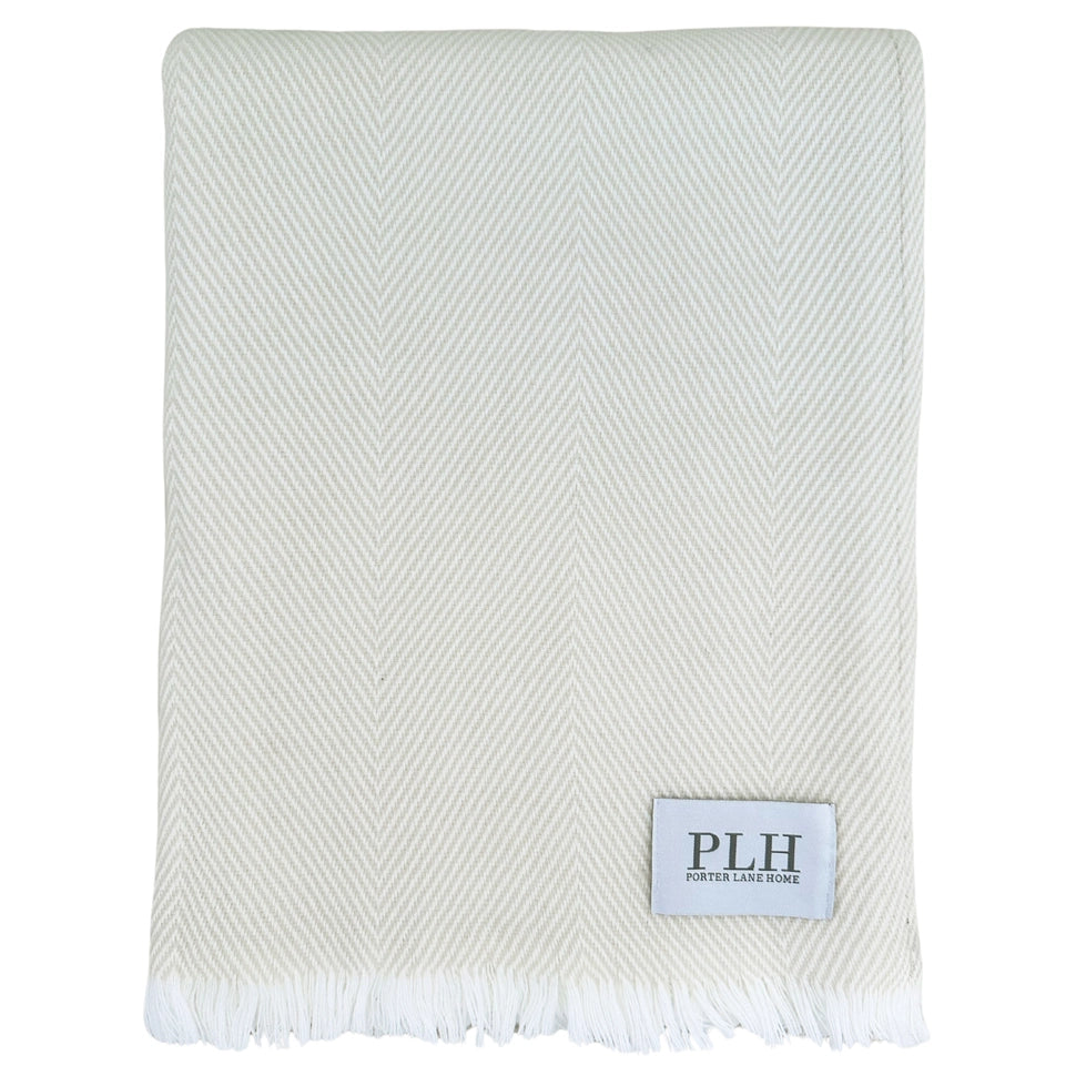 close up of herringbone blanket included in our heart of home gift basket.