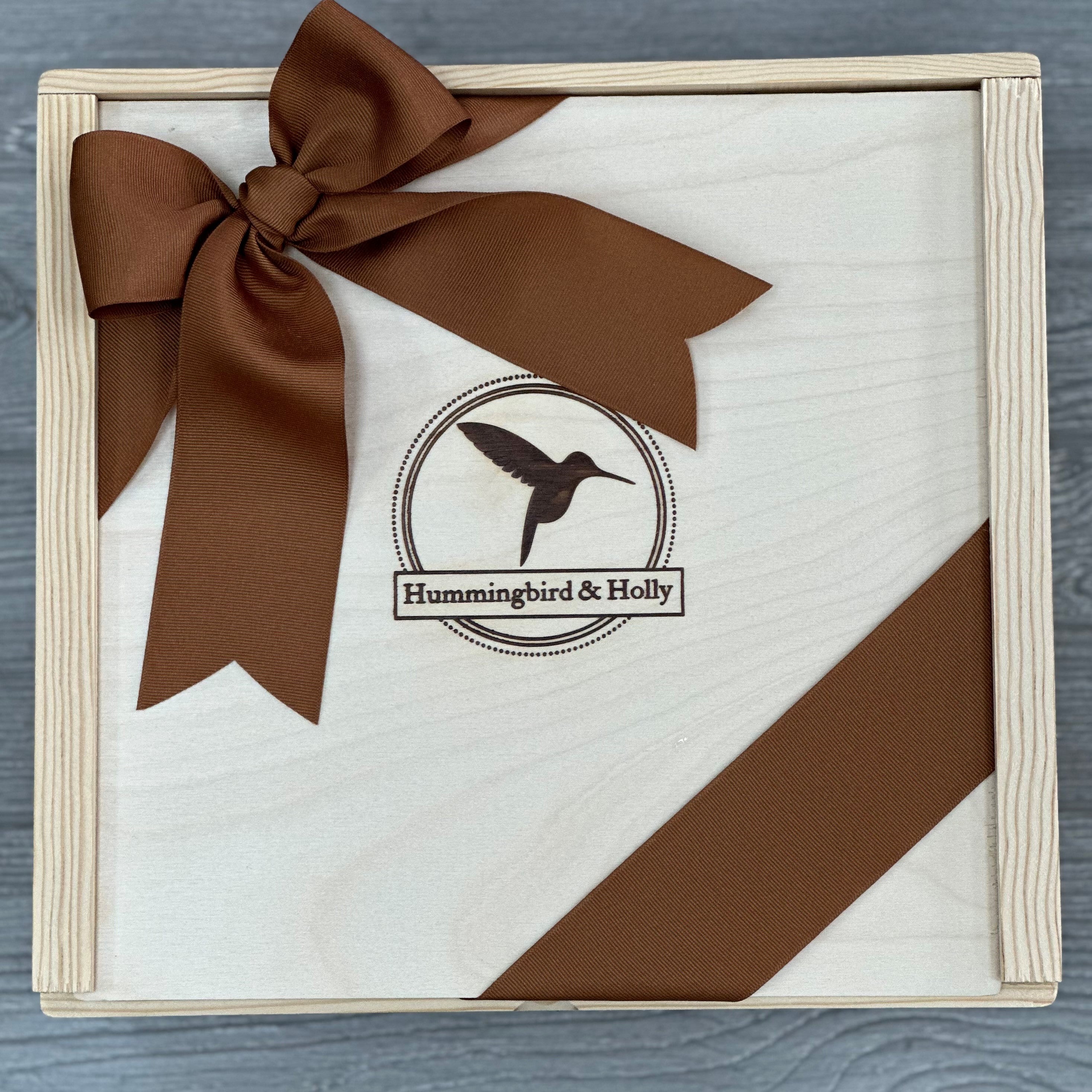 close up of our 11x11 wooden slide lid box included in our pnw housewarming gift basket
