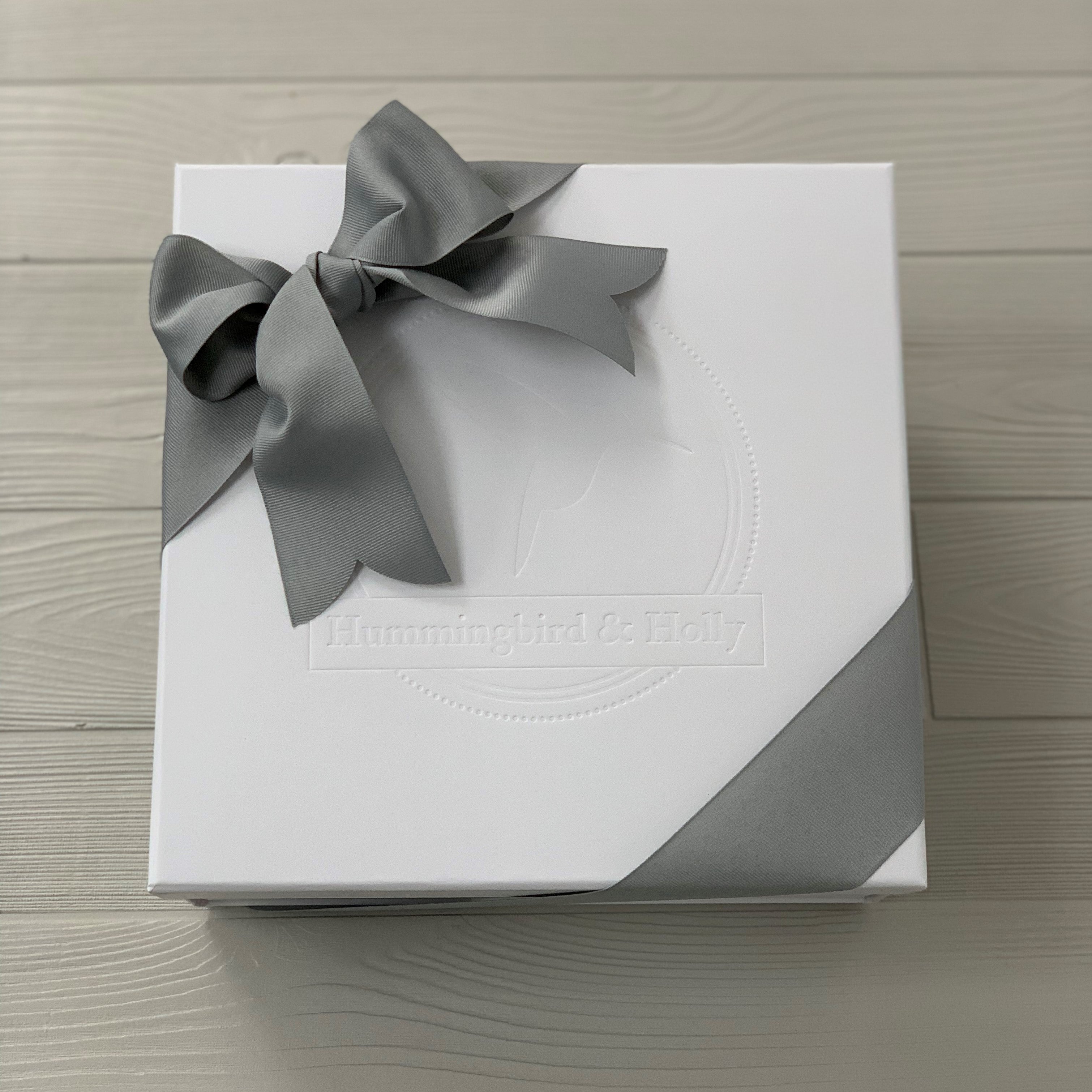 close up of the white gift box included in our snips & snails & puppy dog tails gift basket
