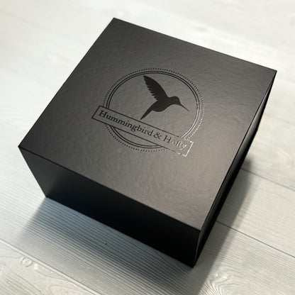 close up of 8x8 black gift box included in our Puppy Love gift basket
