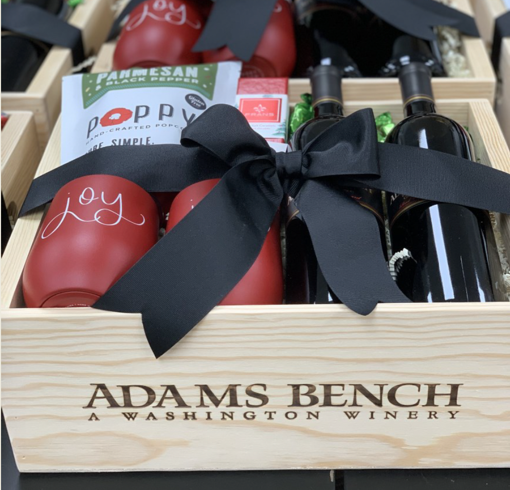 corporate gift basket with wine, insulated wine tumblers, popcorn, Fran's chocolate and Adams Bench Winery logo