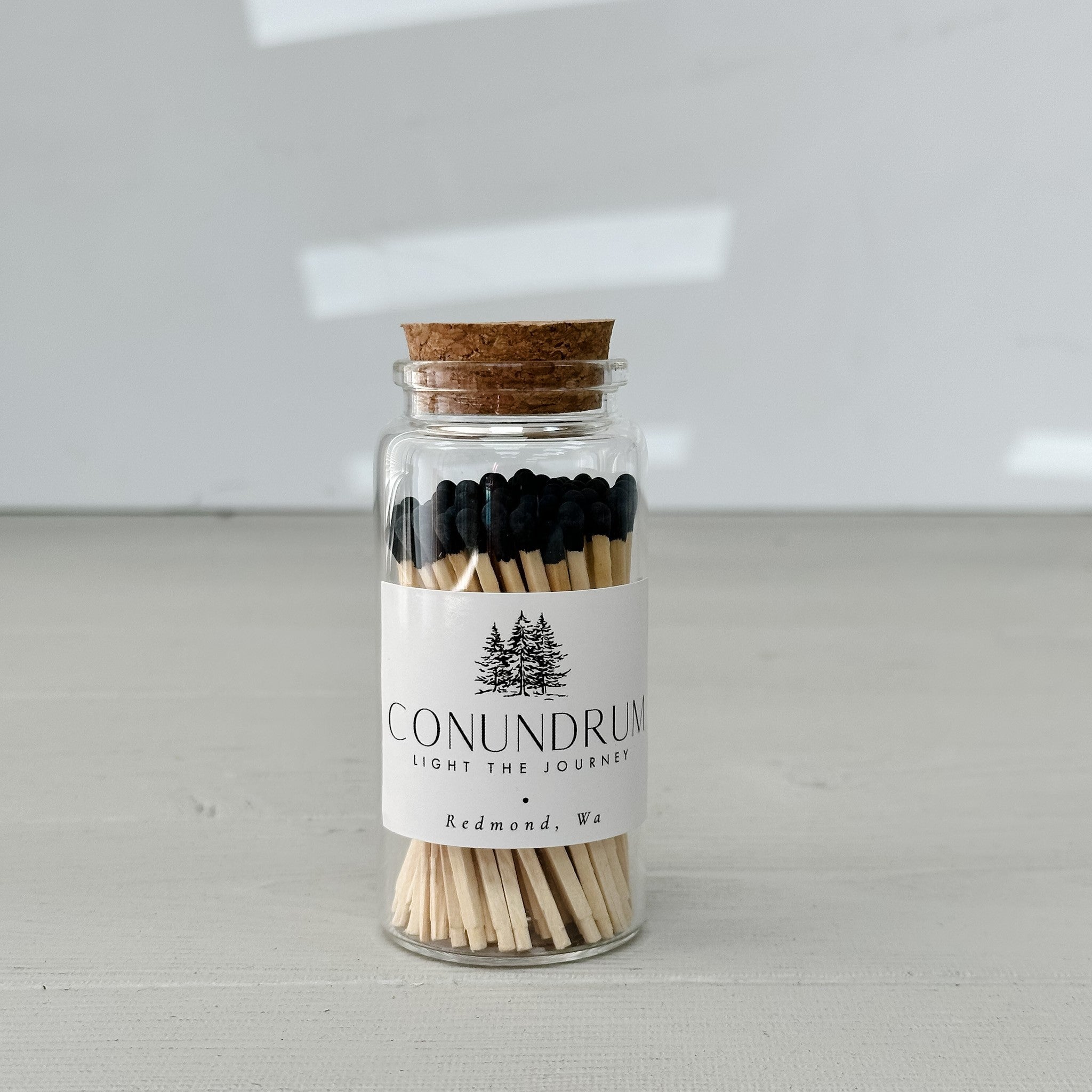 glass jar of black matches