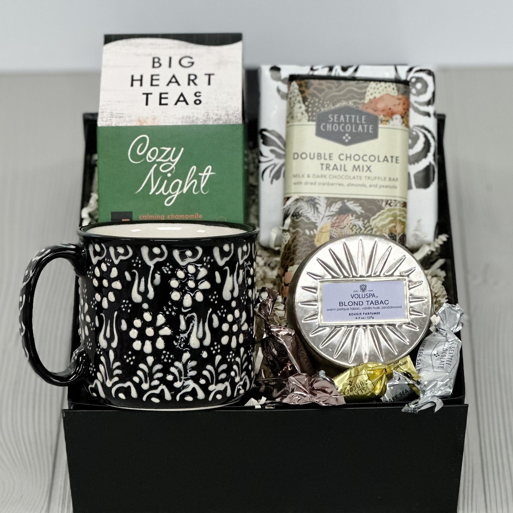 mug, tea, chocolate, shortbread, candle all included in our cozy night gift basket.