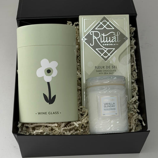 Stemless wine glass, chocolate and scented candle included in our Petal and Pour gift box.