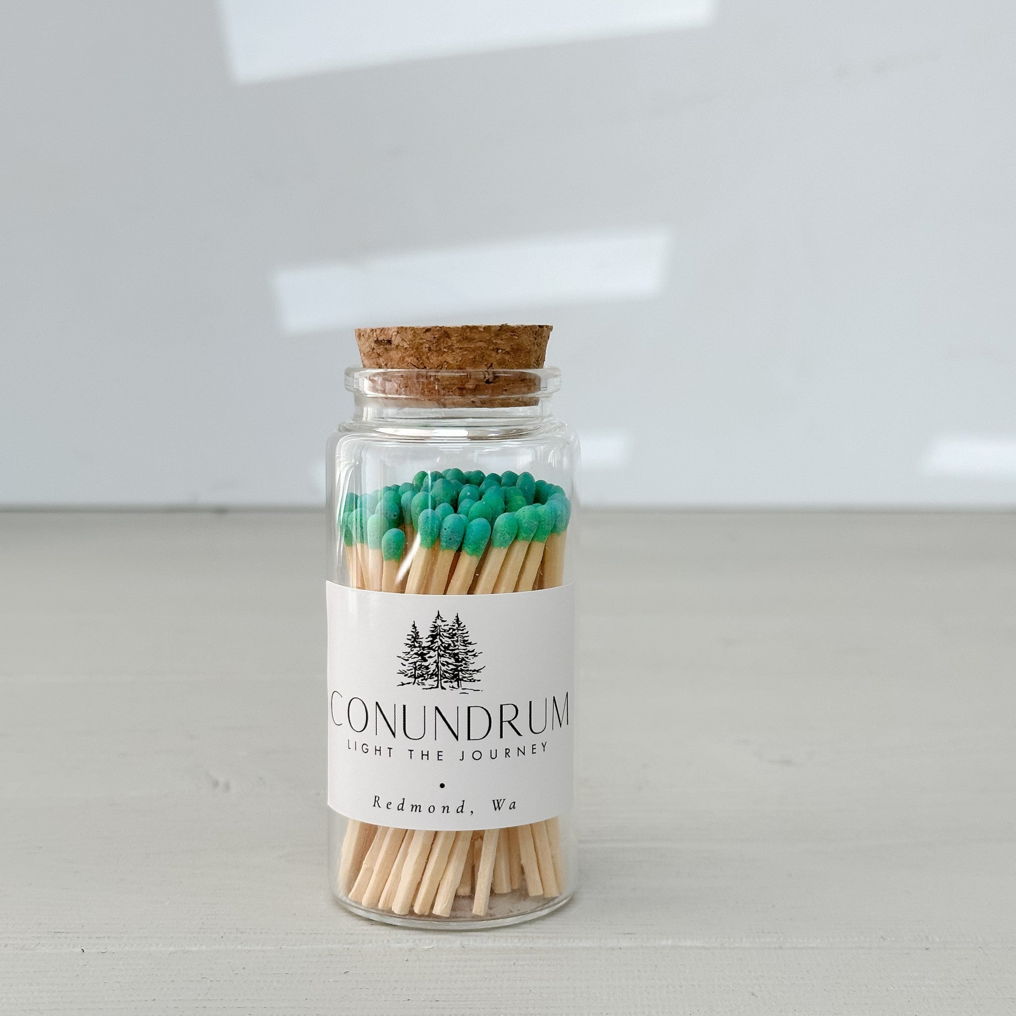 glass jar of green matches by conundrum snacks.