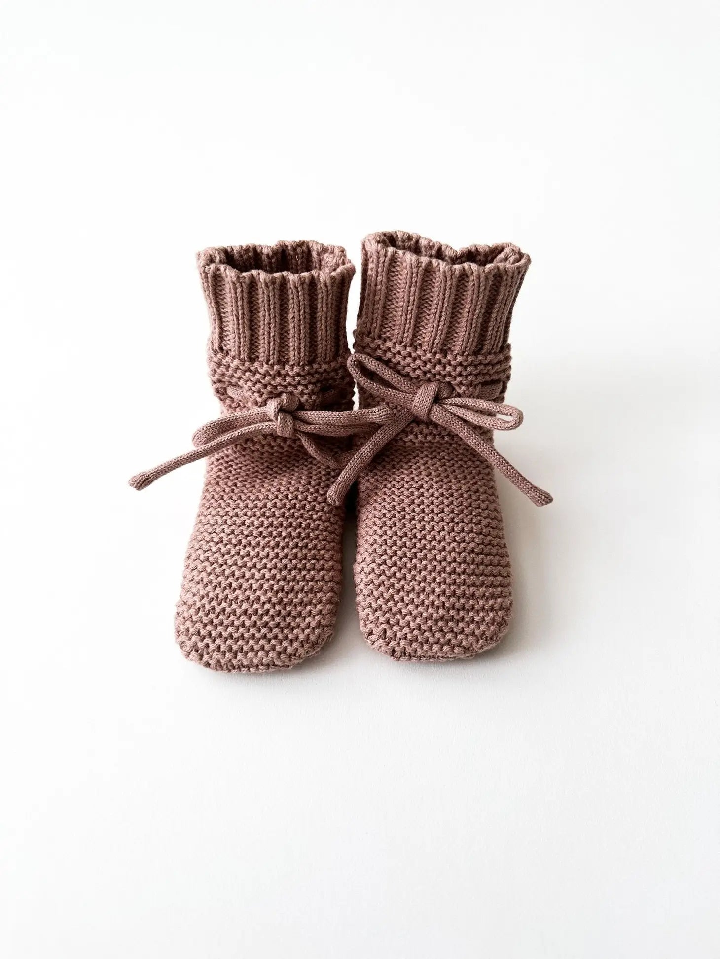 knit booties in baby gift basket