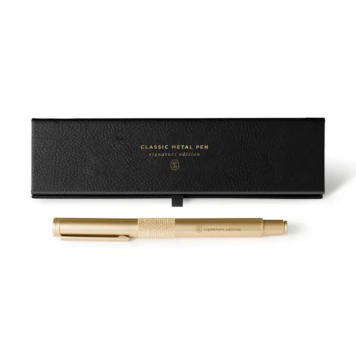 Gold metal pen with black leather case on a white background