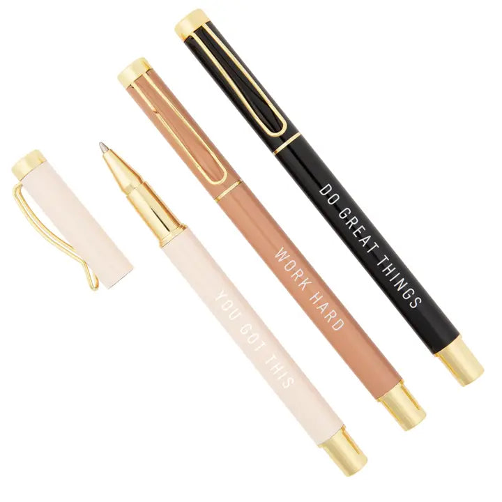 Set of four pens with motivational text on a white background