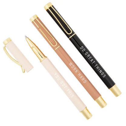Set of four pens with motivational text on a white background