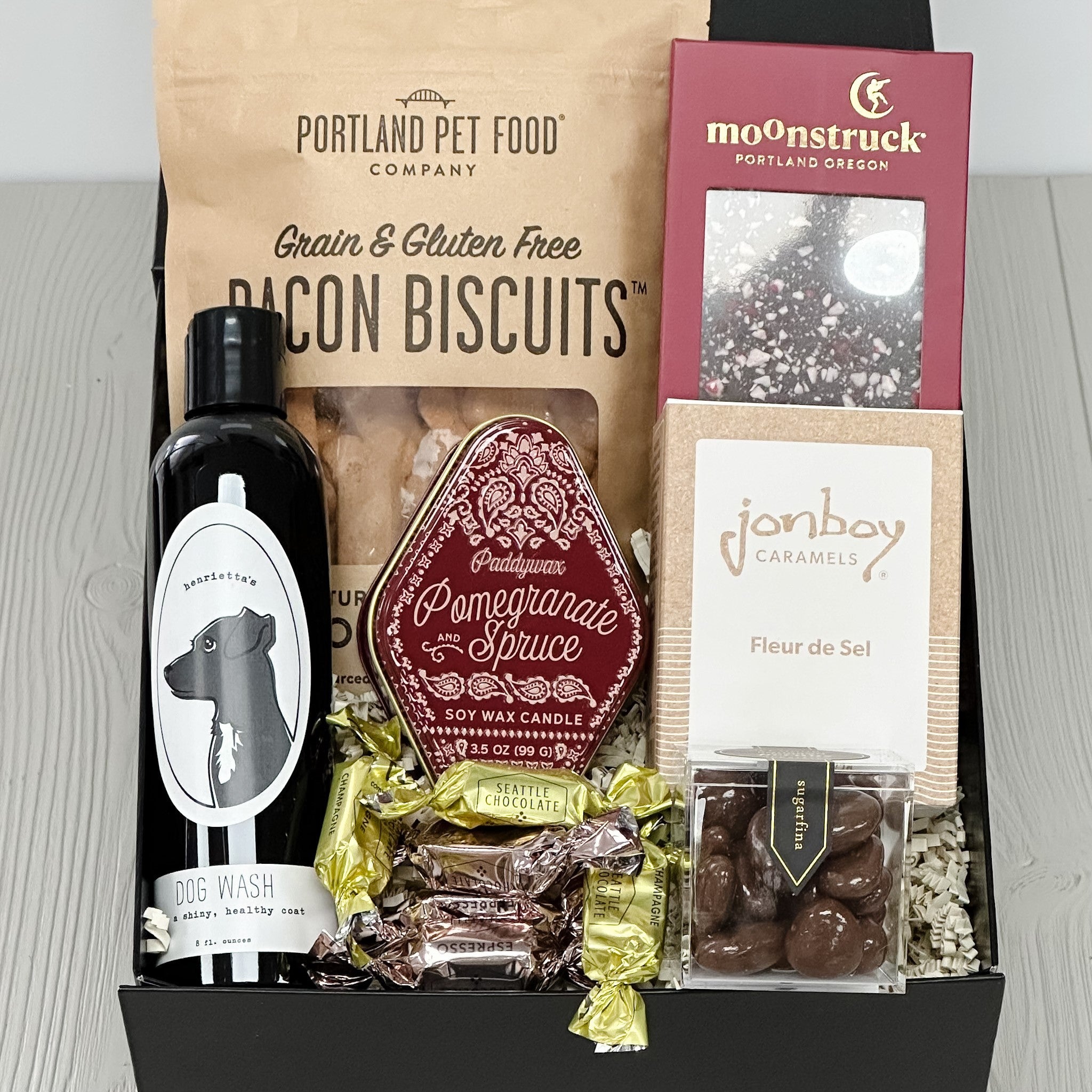 dog biscuits, chocolate, caramel, pecans, truffles, dog shampoo all included in our puppy love gift basket.