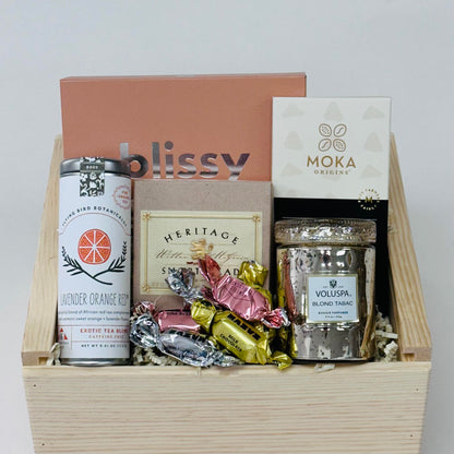 silk sleep mask, candle, tea,  shortbread, and chocolate, all included in our sweet dreams gift box.