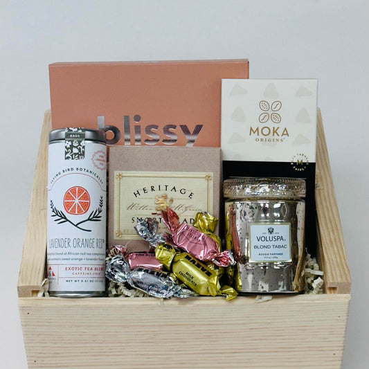 silk sleep mask, candle, tea,  shortbread, and chocolate, all included in our sweet dreams gift box.